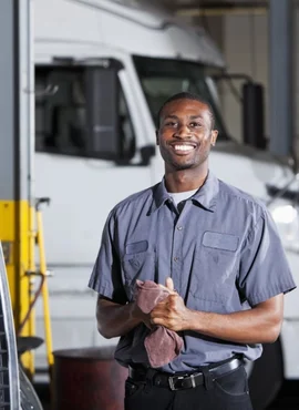 Truck mechanic and driver at fleet facility